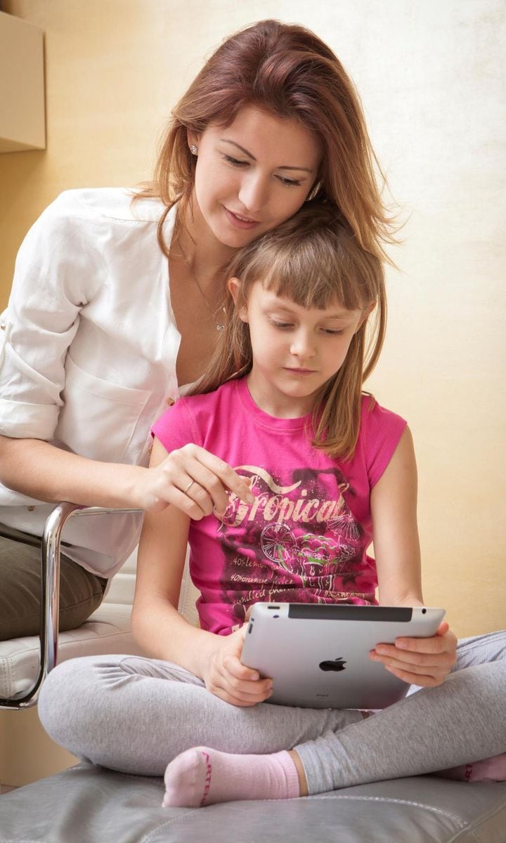 Mother And Daughter With Ipad