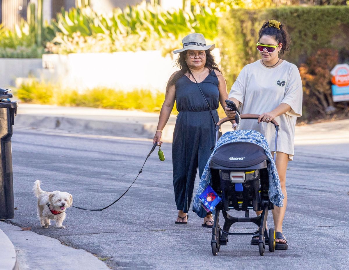 New mom Vanessa Hudgens steps out for a stroll with her newborn, mom, and dog. 