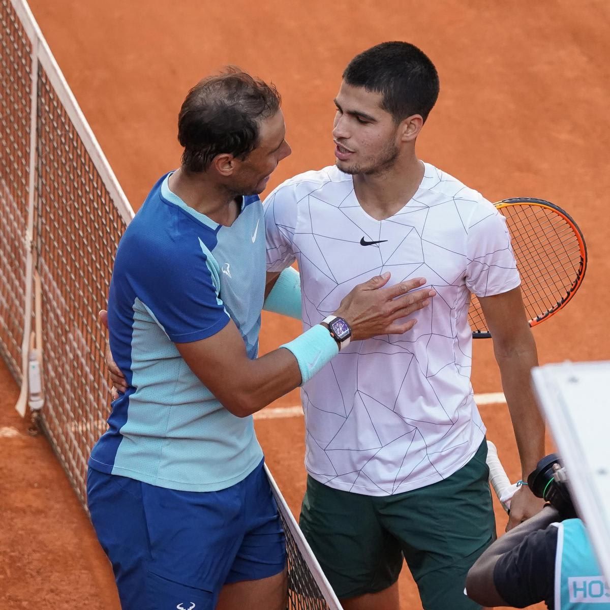 Spain's Rafael Nadal shakes hands with Spain's Carlos