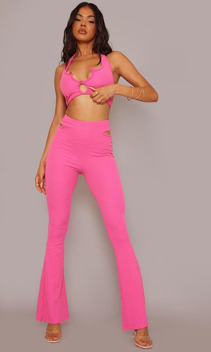 Hot Pink Crinkle Rib Cut Out Side Detail Flared Pants from PrettyLittleThing