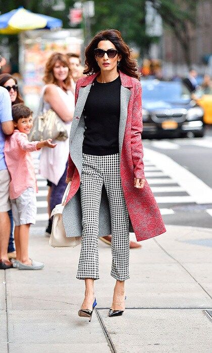 While in New York City to address the United Nations regarding ISIS' genocide, Amal took to the streets wearing a lace red Altuzarra coat and checkered pants paired with Giambattista Valli pumps.
Photo: James Devaney/GC Images