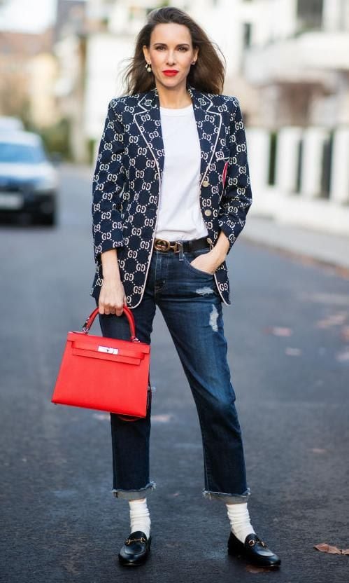 Alexandra Lapp with a look featuring jeans and loafers with white stockings