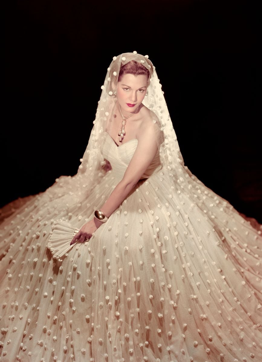 Maria Montez poses in ornate wedding gown, circa 1943. (Photo by Screen Archives/Getty Images)