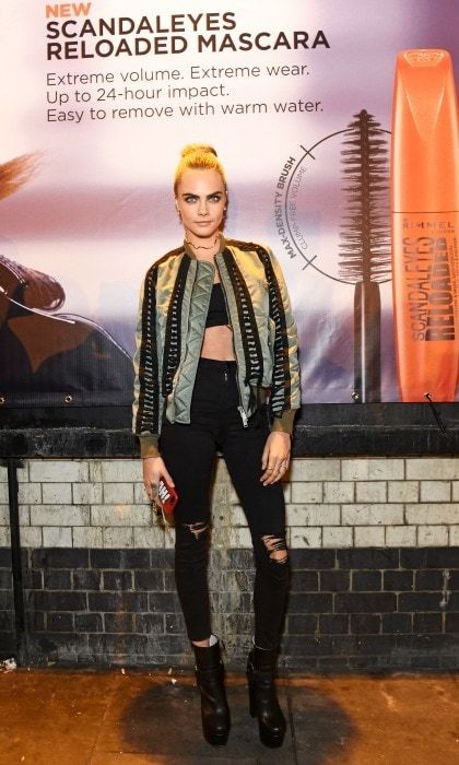 November 9: Cropped style! Cara Delevingne dressed her black crop top and distressed denim with a bomber jacket during the celebration of her partnership with Rimmel in London.
Photo: David M. Benett/Dave Benett/Getty Images for Rimmel