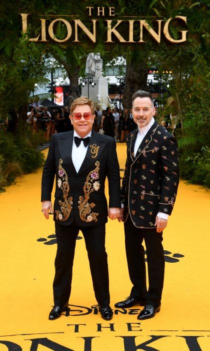 Elton John and husband at The Lion King