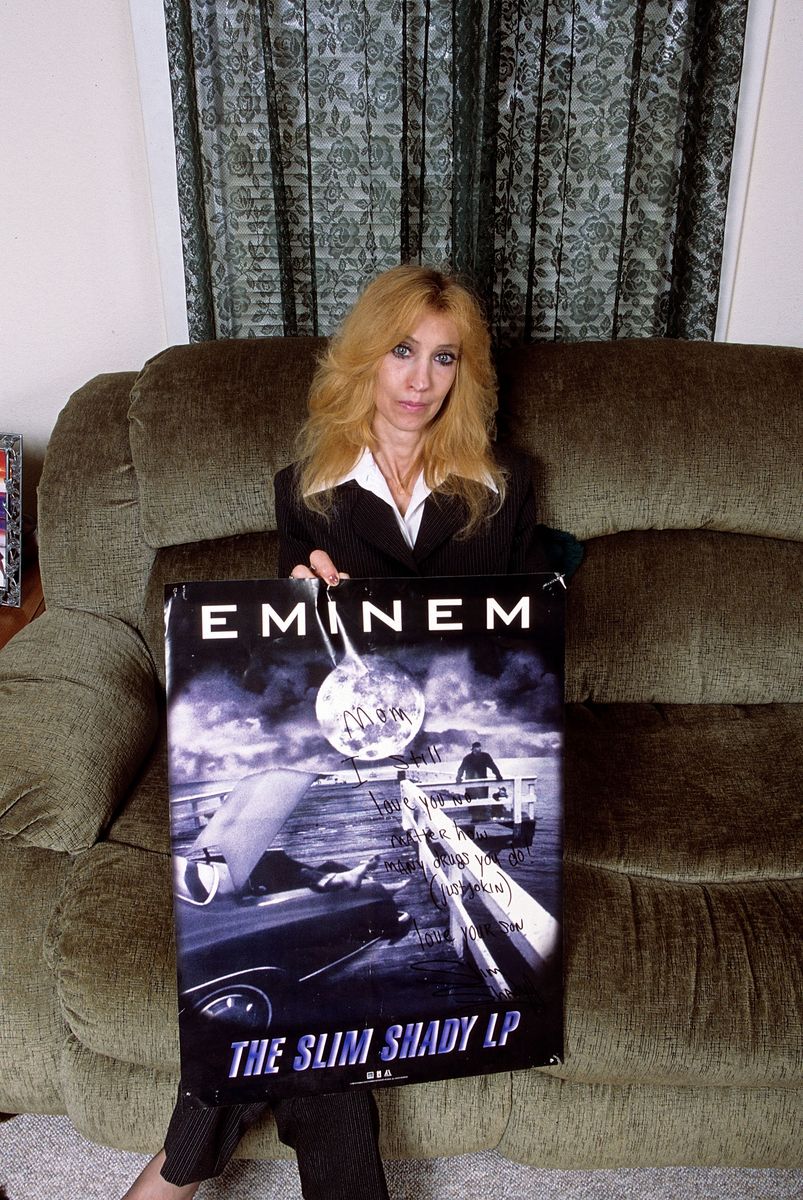 DETROIT, MI - SEPTEMBER, 2005:  (EXCLUSIVE COVERAGE) Eminem's mother Debbie Mathers holds a poster with a hand written message during a portrait session at her home in September, 2005 in Detroit, Michigan.  (Photo by Mark Weiss/Getty Images) 