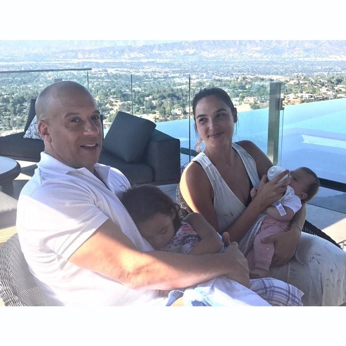 Vin Diesel and Gal Gadot took a break from saving the world as superheroes to spend quality time with their kids. The <i>Guardians of the Galaxy</i> star captioned the photo with his <i>Fast & the Furious</i> co-star, "When we aren't playing superheroes... All love."
The dad-of-three held on to his nine-year-old daughter Hania Riley as Gal fed her baby girl Maya.
Photo: Facebook/VinDiesel