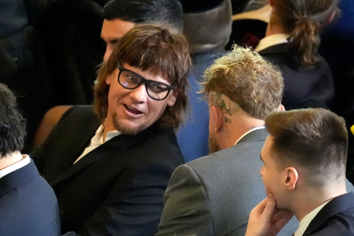 Comedian Theo Von (L) speaks with Jake Paul in the VIP viewing area in Emancipation Hall for the Inauguration of Donald J. Trump