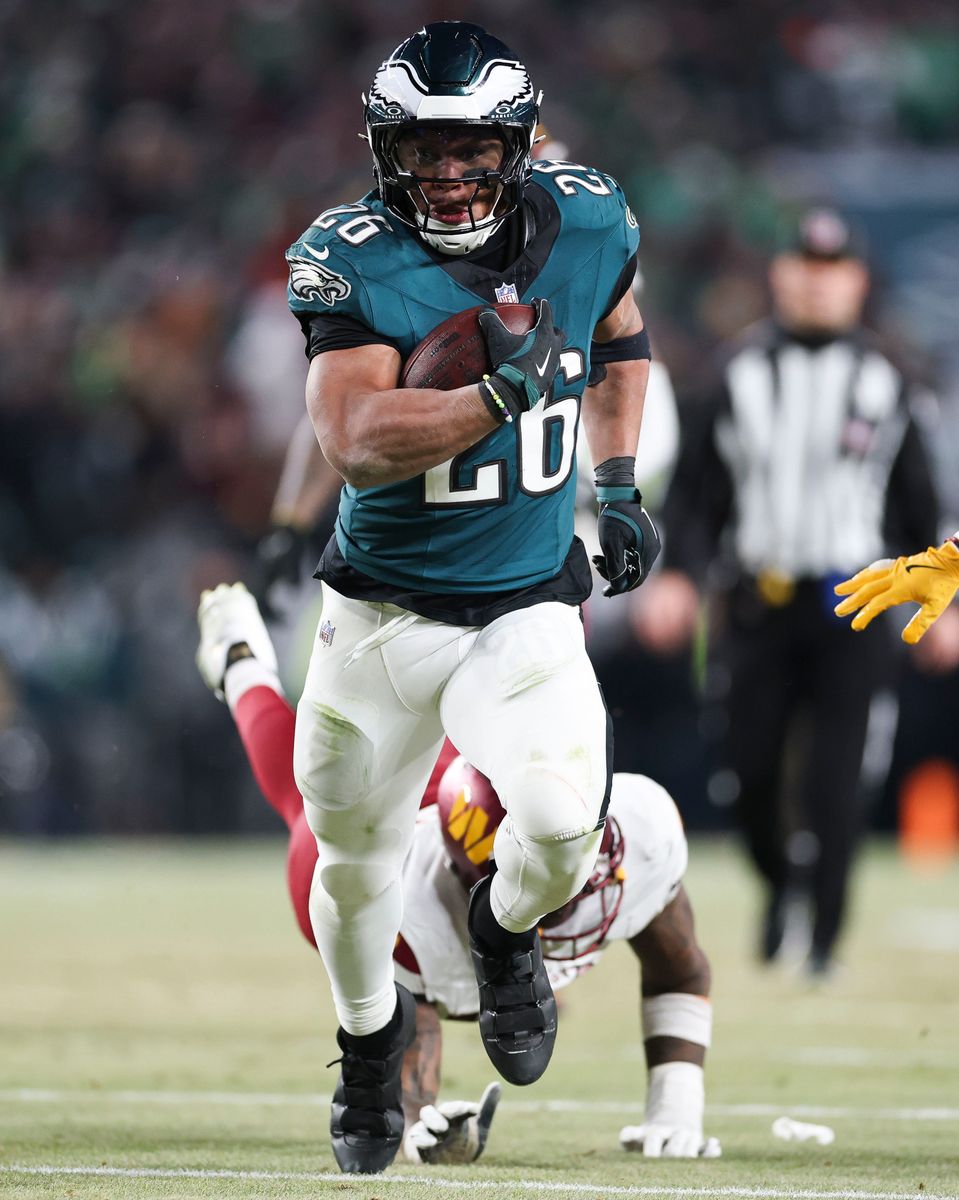 PHILADELPHIA, PENNSYLVANIA - JANUARY 26: Saquon Barkley #26 of the Philadelphia Eagles runs with the football during the fourth quarter in the NFC Championship Game against the Washington Commanders at Lincoln Financial Field on January 26, 2025 in Philadelphia, Pennsylvania. (Photo by Kathryn Riley/Getty Images)