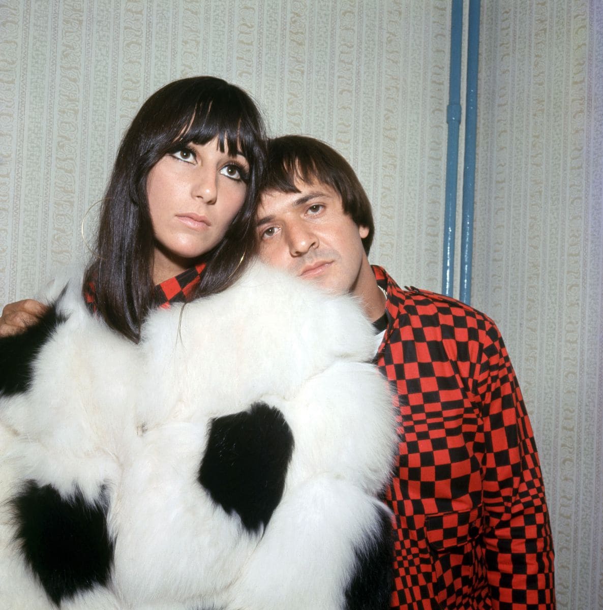 LONDON - 1966: (L-R) Sonny Bono (1935-1998), an American singer-songwriter, producer, actor, and politician and his then-wife Cher, an American singer, actress and television personality, who together were an American rock duo in the 1960s and 1970s. The couple started their career in the mid-1960s as R&B backing singers for record producer Phil Spector, in London, England, 1966. (Photo by Jeff Hochberg/Getty Images)