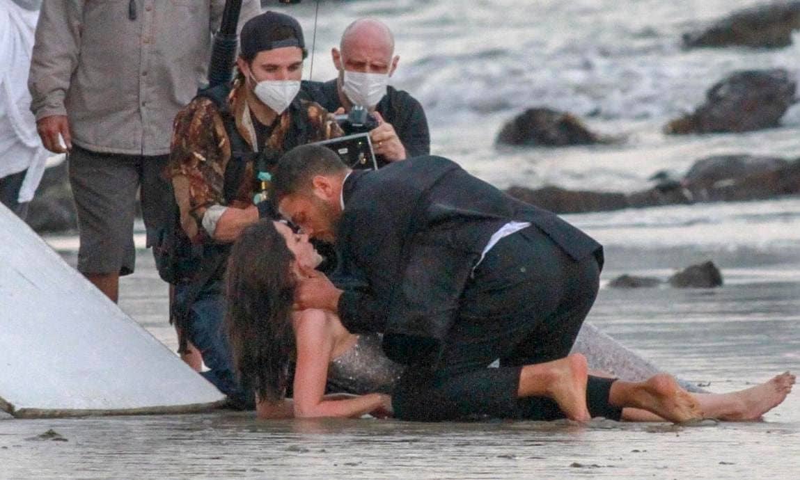 Ana De Armas shares a kiss with a male model on set of a perfume commercial