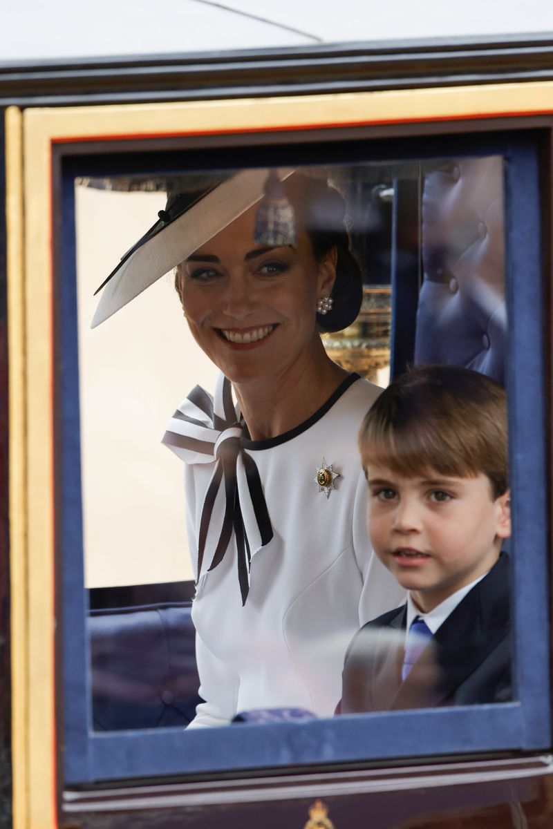  Catherine, Princess of Wales and Prince Louis of Wales during Trooping the Colour at Horse Guards Parade on June 15, 2024 in London, England. Trooping the Colour is a ceremonial parade celebrating the official birthday of the British Monarch. The event features over 1,400 soldiers and officers, accompanied by 200 horses. More than 400 musicians from ten different bands and Corps of Drums march and perform in perfect harmony. (Photo by John Phillips/Getty Images)