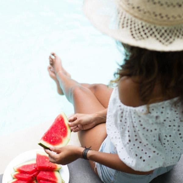 Woman eating watermelon