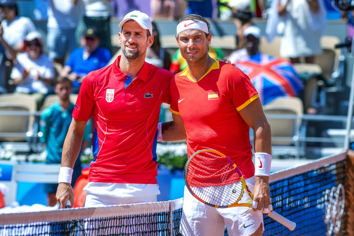 PARIS, FRANCE: JULY 29:  Novak Djokovic of Serbia and Rafael Nadal of Spain pose for a photograph at the net before their second round match of the Mens Singles Competition during the Paris 2024 Summer Olympic Games on July 29th, 2024 in Paris, France. (Photo by Tim Clayton/Corbis via Getty Images)