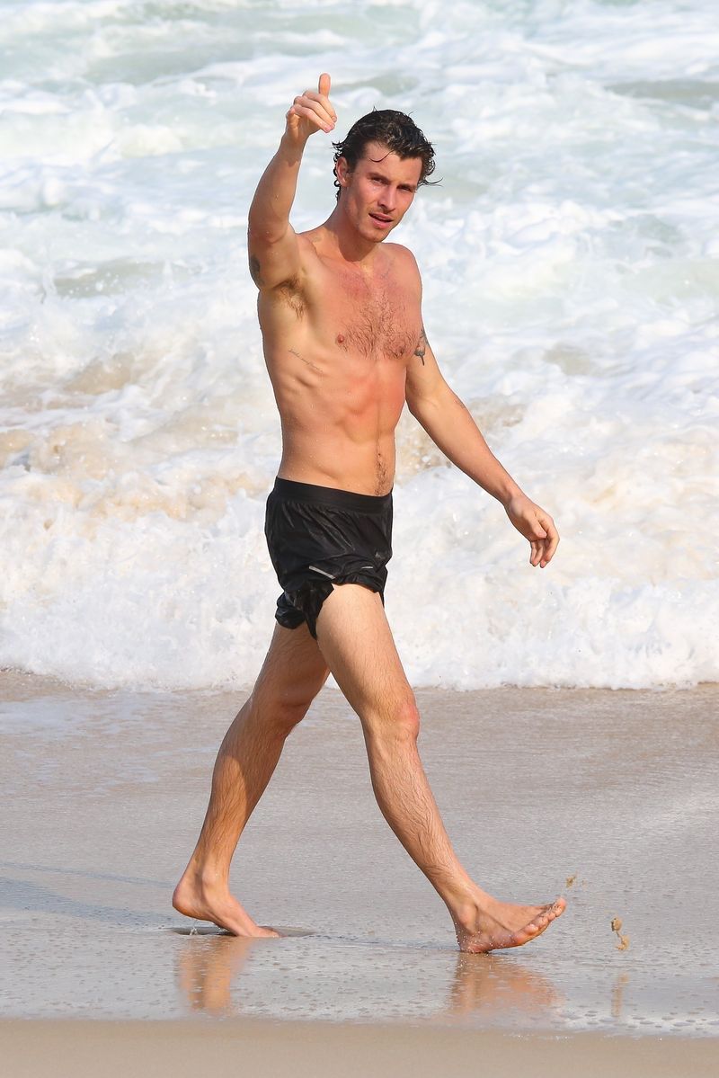 Shawn Mendes was spotted enjoying the beach in Rio de Janeiro, where he surfed and spent time with friends. 