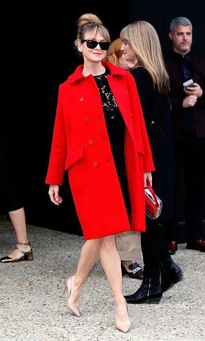 Tres chic! Renee channeled her inner Parisian during 2015 Paris Fashion Week Womenswear Fall/Winter, wearing a red coat and black dress to the Miu Miu presentation.
<br>
Photo: Pierre Suu/Getty Images