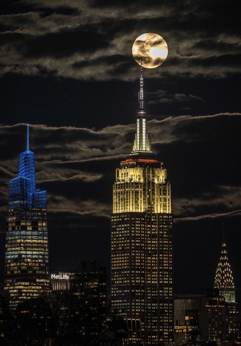 The full Beaver Moon rises over the Empire State Building on November 27, 2023, in New York City. 