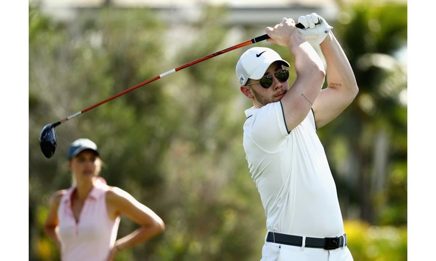 Nick Jonas looked tee-rrific as he made a shot while participating in the Pro-Am tournament with PGA professional golfer Jordan Spieth prior to the 2018 Sony Open in Honolulu, Hawaii on January 10.
Photo: Gregory Shamus/Getty Images