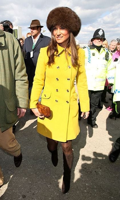 Pippa looked warm and stylish in a banana yellow coat and fur hat.
<br>
Photo: Getty Images
