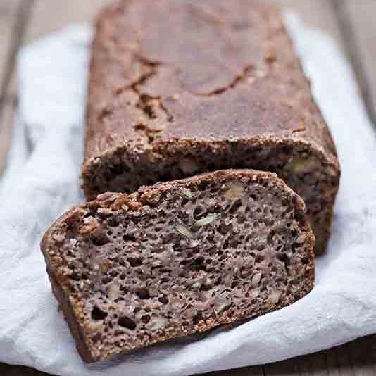 Slice of whole-grain bread and loaf