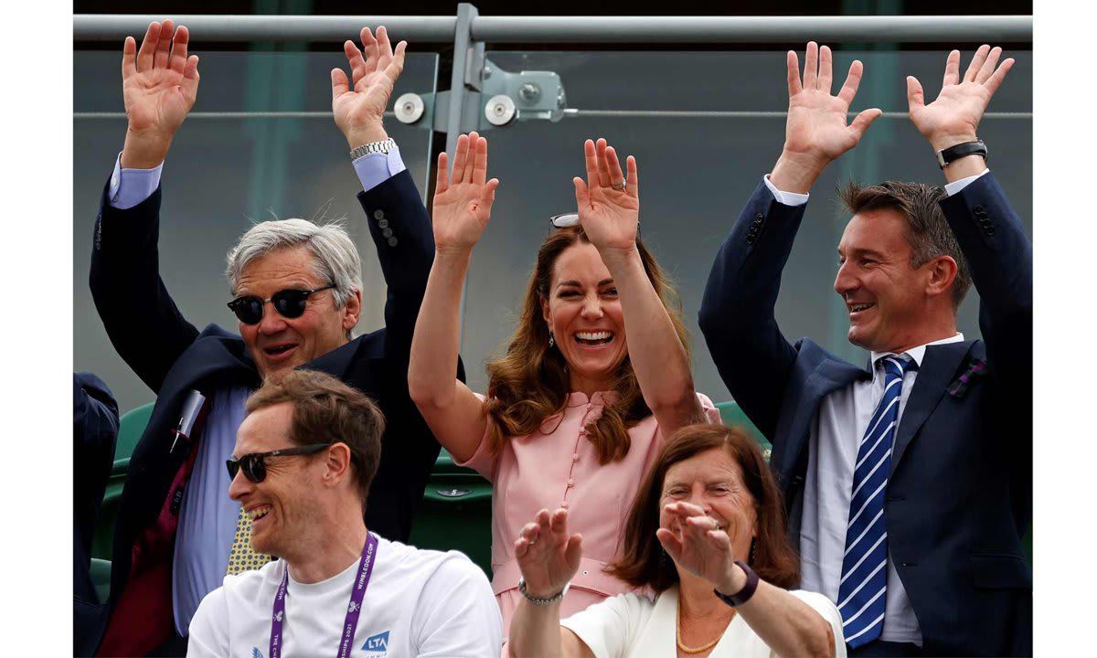 TOPSHOT - Britain's Catherine, Duchess of Cambridge (C), her father Michael Middleton (L) and Scott Lloyd (R), CEO of the Lawn Tennis Association (LTA) take part in a 'mexican wave' as they watch Britain's the Gordon Reid play against Belgium's Joachim Gerard in the final of the Gentlemen's Wheelchair Singles on the thirteenth day of the 2021 Wimbledon Championships at The All England Tennis Club in Wimbledon, southwest London, on July 11, 2021. - - RESTRICTED TO EDITORIAL USE (Photo by Adrian DENNIS / POOL / AFP) / RESTRICTED TO EDITORIAL USE (Photo by ADRIAN DENNIS/POOL/AFP via Getty Images)