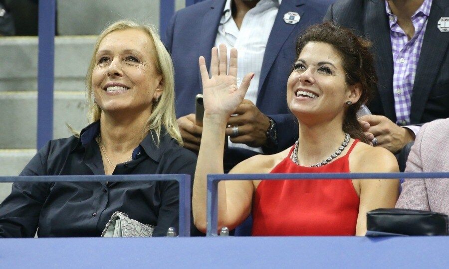 Debra Messing shot a smile and a wave to the camera alongside Martina Navratilova.
<br>
Photo: GC Images