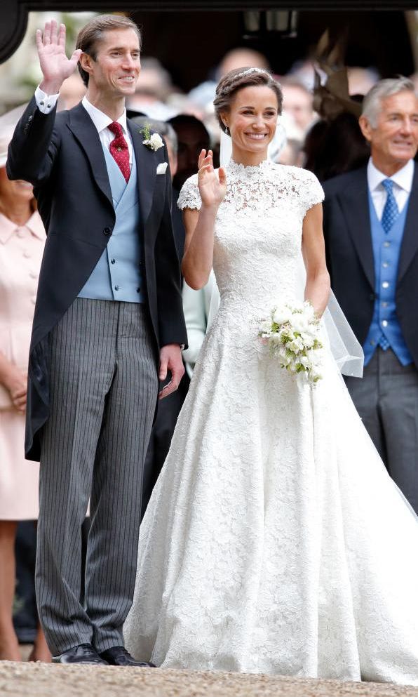 Pippa Middleton in a Giles Deacon wedding dress with husband James Matthews
