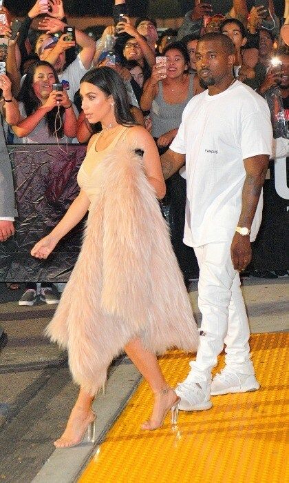 June 24: Kim Kardashian and Kanye West walked inside of the Forum in Los Angeles for the premiere of the rapper's latest visuals to his song <i>Famous</i>. Not only does the video include the controversial line about Taylor Swift, it features look-alikes of the singer, Donald Trump, Ray J and a slew of other A-List celebrities.
<br>
Photo: GC Images