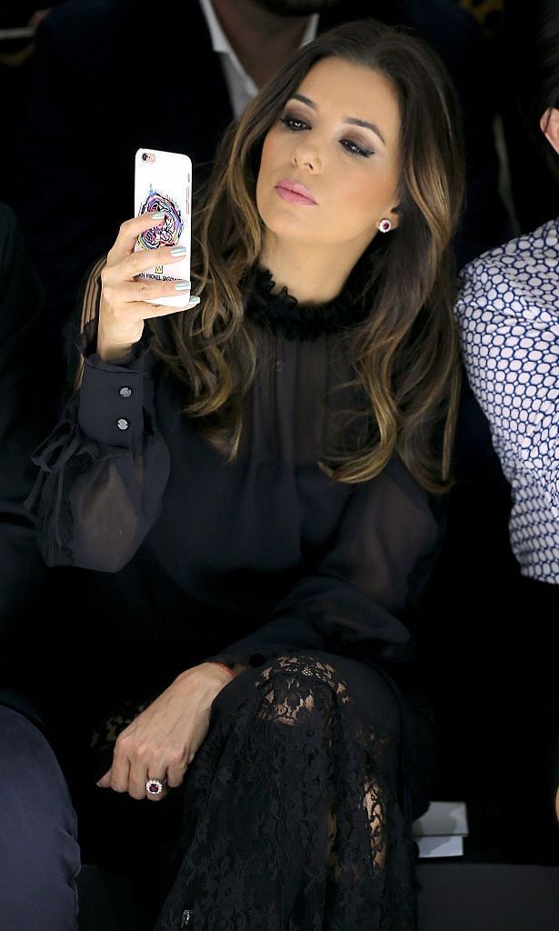 Eva Longoria sat front row at the Shiatzy Chen show, where she snapped photos of the fall/winter looks.
<br>
Photo: Getty Images