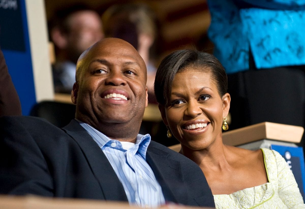 Michelle Obama and her brother Craig Robinson attend the Democratic National Convention in Denver. (Photo by Rick Friedman/Corbis via Getty Images)