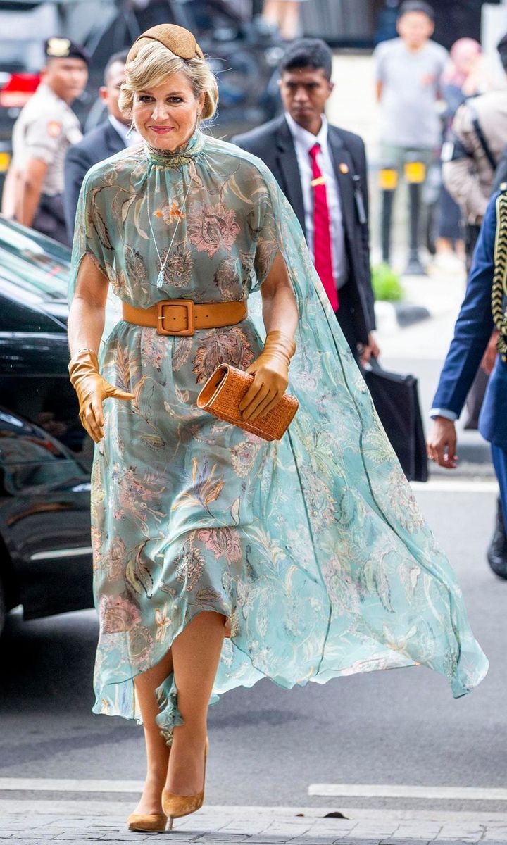 The Dutch royal paired the headpiece with a cape dress by Natan and matching accessories