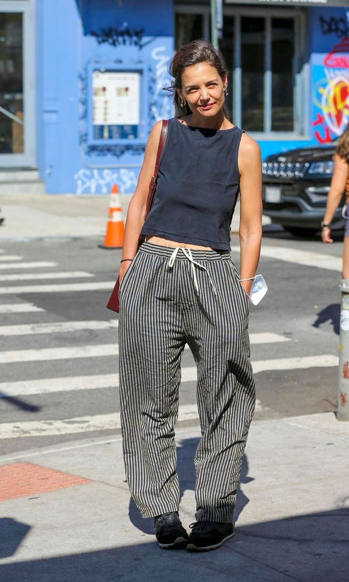 Actress Katie Holmes wears striped pants with a drawstring and a sleeveless top