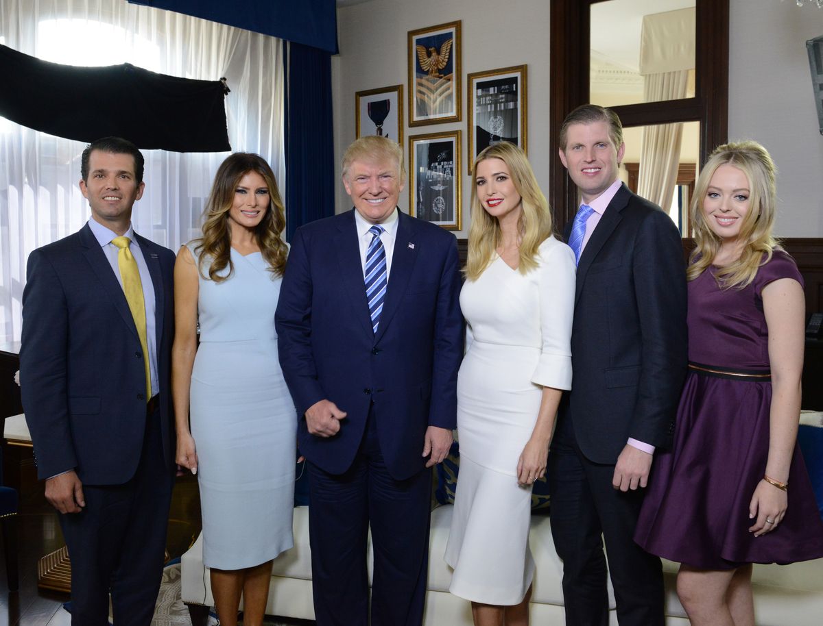 The Trump family gathers for a photo at the opening of the Trump International Hotel in Washington DC