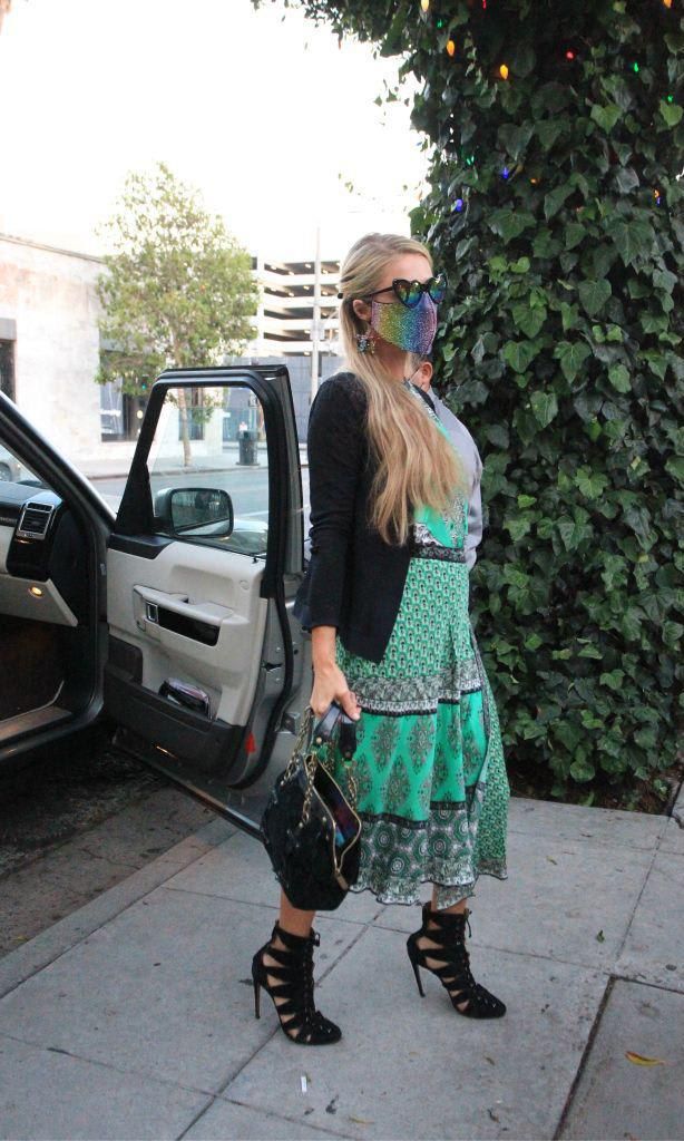 Paris Hilton spotted getting out of car in Los Angeles, CA. with pretty green dress.