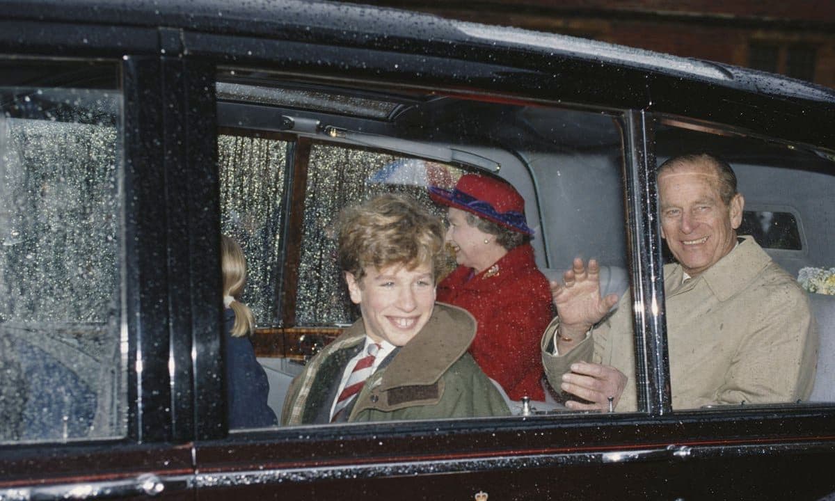 The Duke was all smiles riding in the car with his grandson as he and the Queen visited Peter and Zara Phillips' school in 1991.