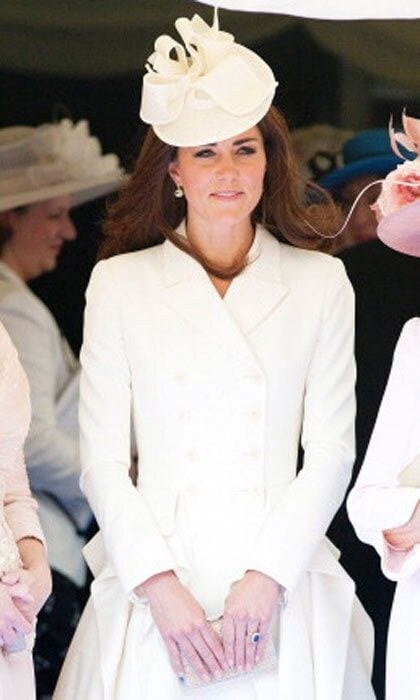 Kate opts for a shorter dress and Alexander McQueen coat with this look and pulls it off with a matching cocktail hat. She wore the coat just months earlier at another event.
<br>
Photo: Getty Images