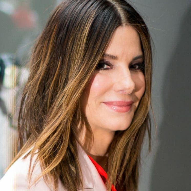 Sandra Bullock with her hair down and her smooth and radiant skin