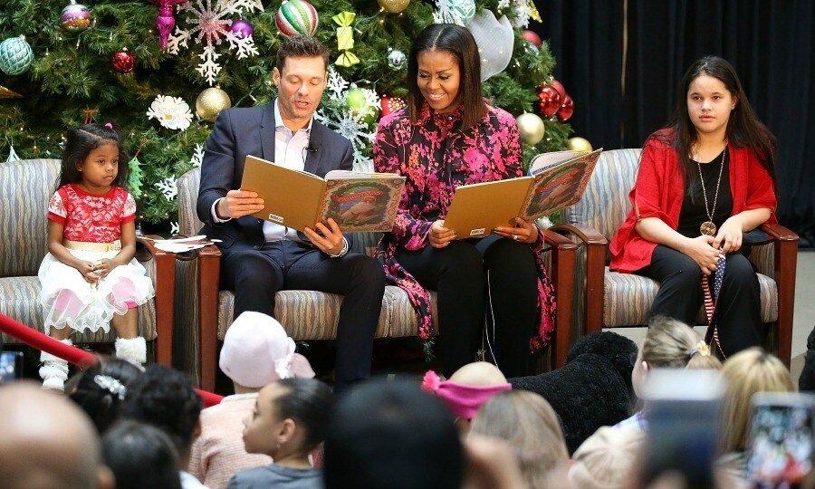 December 12: 'Tis the season! Michelle Obama and Ryan Seacrest read to some lucky kids during a visit to the Children's National Health System in Washington, D.C.
Photo: Paul Morigi/Getty Images