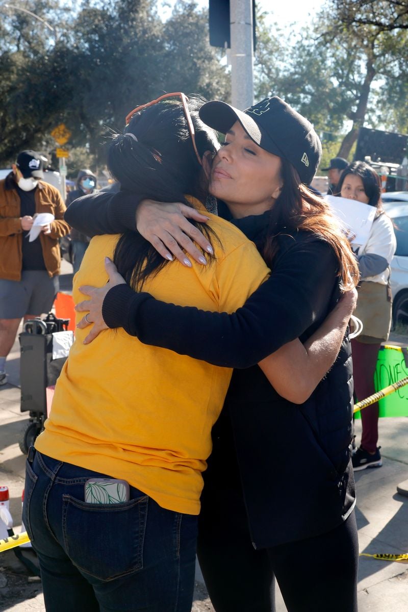 Eva Longoria comforts a fellow volunteer