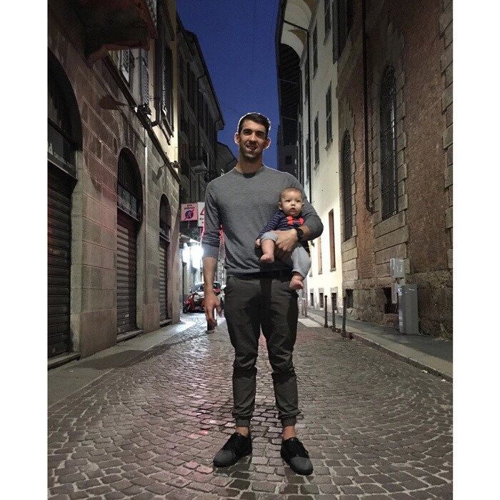 It was a night on the town for the athlete and his son! Michael shared a photo cradling Boomer on a side street in Italy writing, "Walking the streets grabbing some food with the fam !! @boomerrphelps @nicole.m.johnson #boomertravels."
Photo: Instagram/@m_phelps00