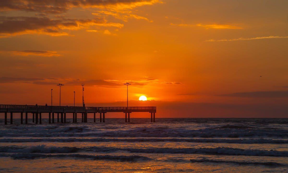 Sunset over Port Aransas pier on Texas Gulf Coast