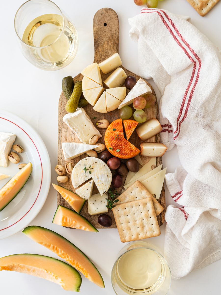 Assorted cheeses, with crackers, olives, and grapes