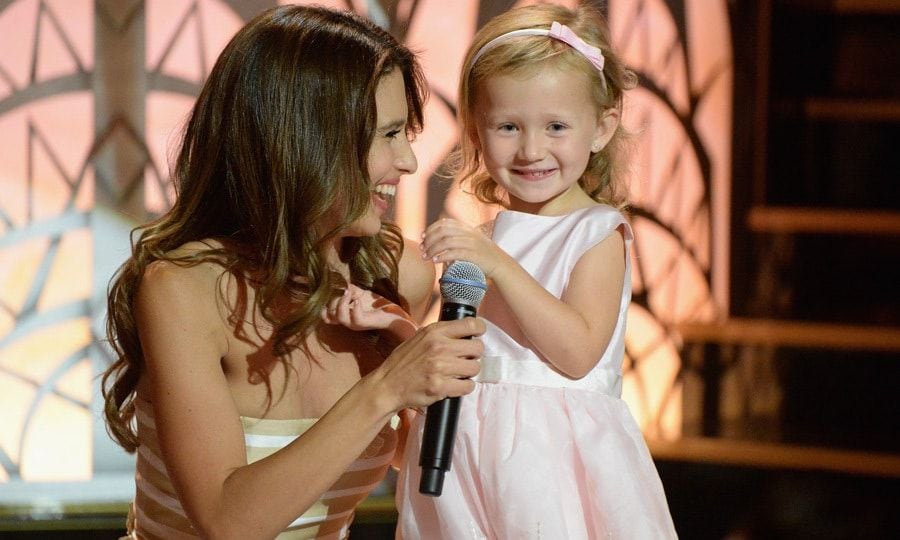 Hilaria Baldwin and Carmen took the stage during Spike TV's <i>One Night Only: Alec Baldwin</i> special in NYC. As her daughter sweetly smiled, the mom-of-three shared to the crowd that also included Alec's daughter Ireland, "Some are born a Baldwin, others marry into it, which means I made a choice, and you think Alec's the crazy one!"
Photo: Getty Images