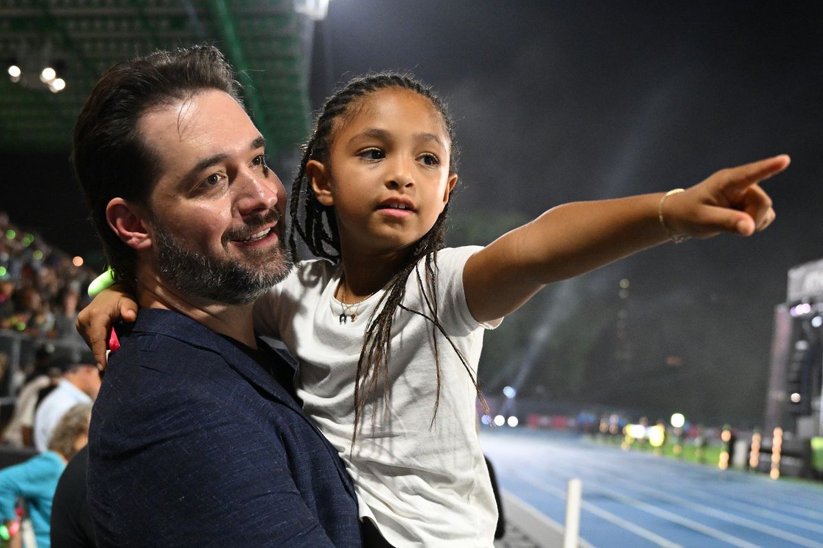 NEW YORK, NEW YORK - SEPTEMBER 26: Alexis Ohanian, founder of Athlos, and his daughter, Olympia Ohanian, react during the Athlos NYC at Icahn Stadium on September 26, 2024 in New York City. (Photo by Bryan Bedder/Athlos/Getty Images for Athlos)