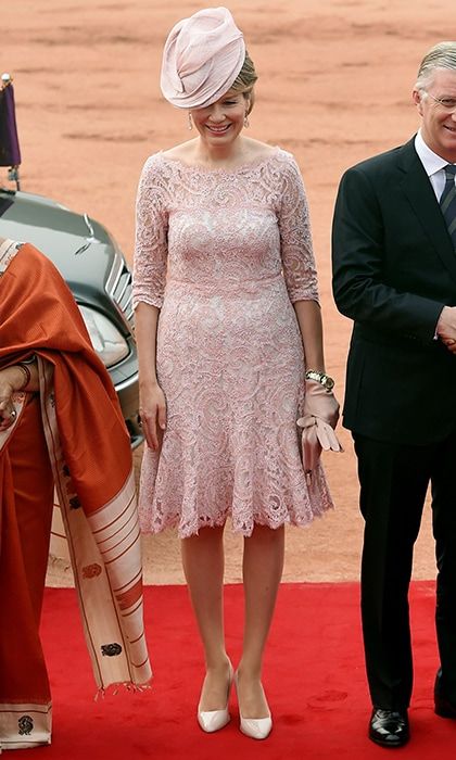 Also traveling abroad is Queen Mathilde of Belgium, who headed to India with husband King Philippe. On November 7, for a ceremonial reception at the Indian Presidential palace in New Delhi, the Belgian Queen wore a dress with powder pink lace overlay, and accessories to match.
Photo: MONEY SHARMA/AFP/Getty Images