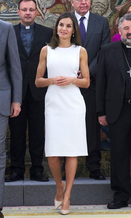 Queen Letizia showed off her toned arms in the perfect LWD by her go-to designer, BOSS, for an outing at Zarzuela Palace on July 10. King Felipe's wife accessorized the nautical-like frock with Prada pumps and pearl and diamond drop earrings. The sleeveless number highlighted the mom-of-two's toned arms and slim physique.
Photo: Getty Images