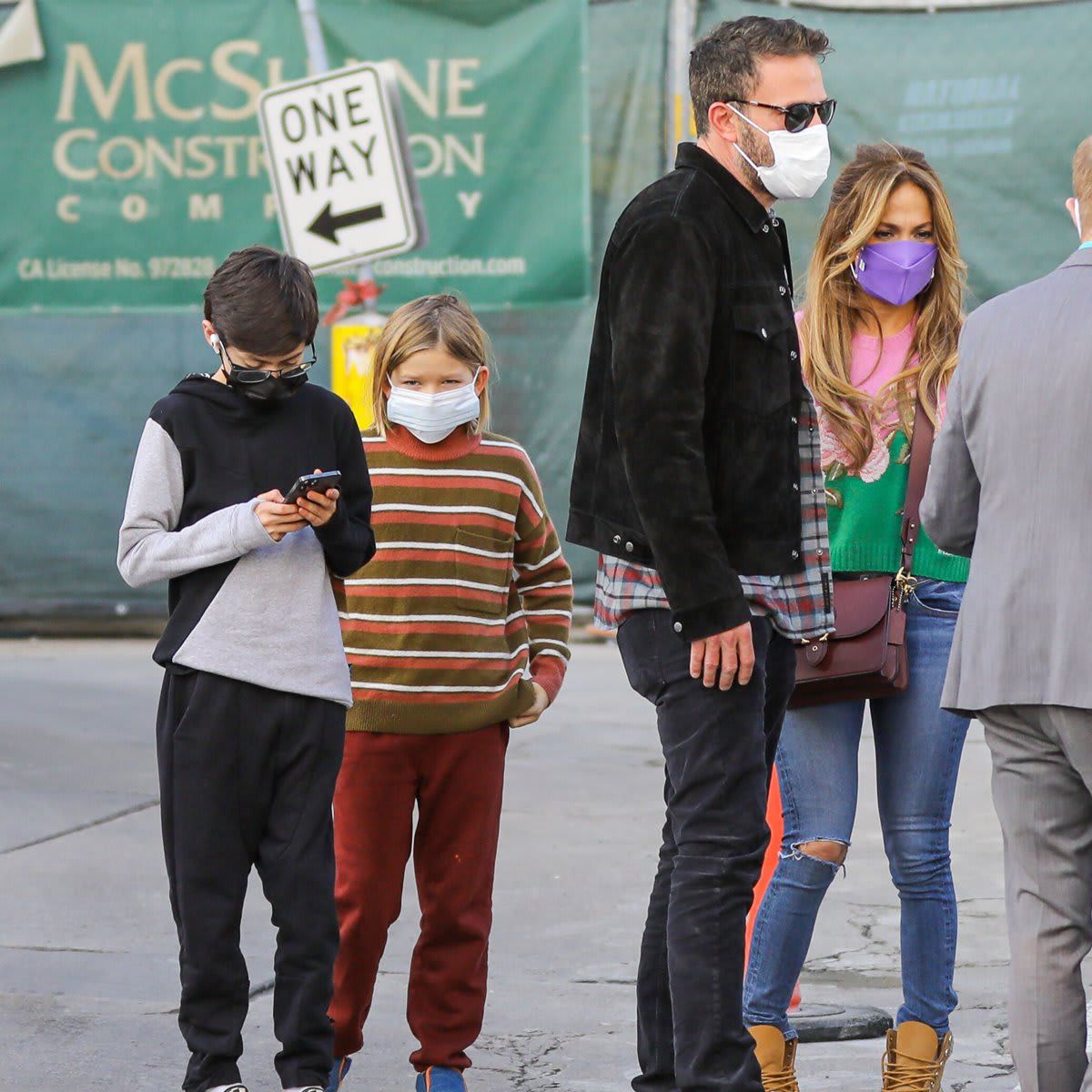 Ben Affleck and Jennifer Lopez hold hands as they head to the movies with their kids at Regency Theater in Westwood.