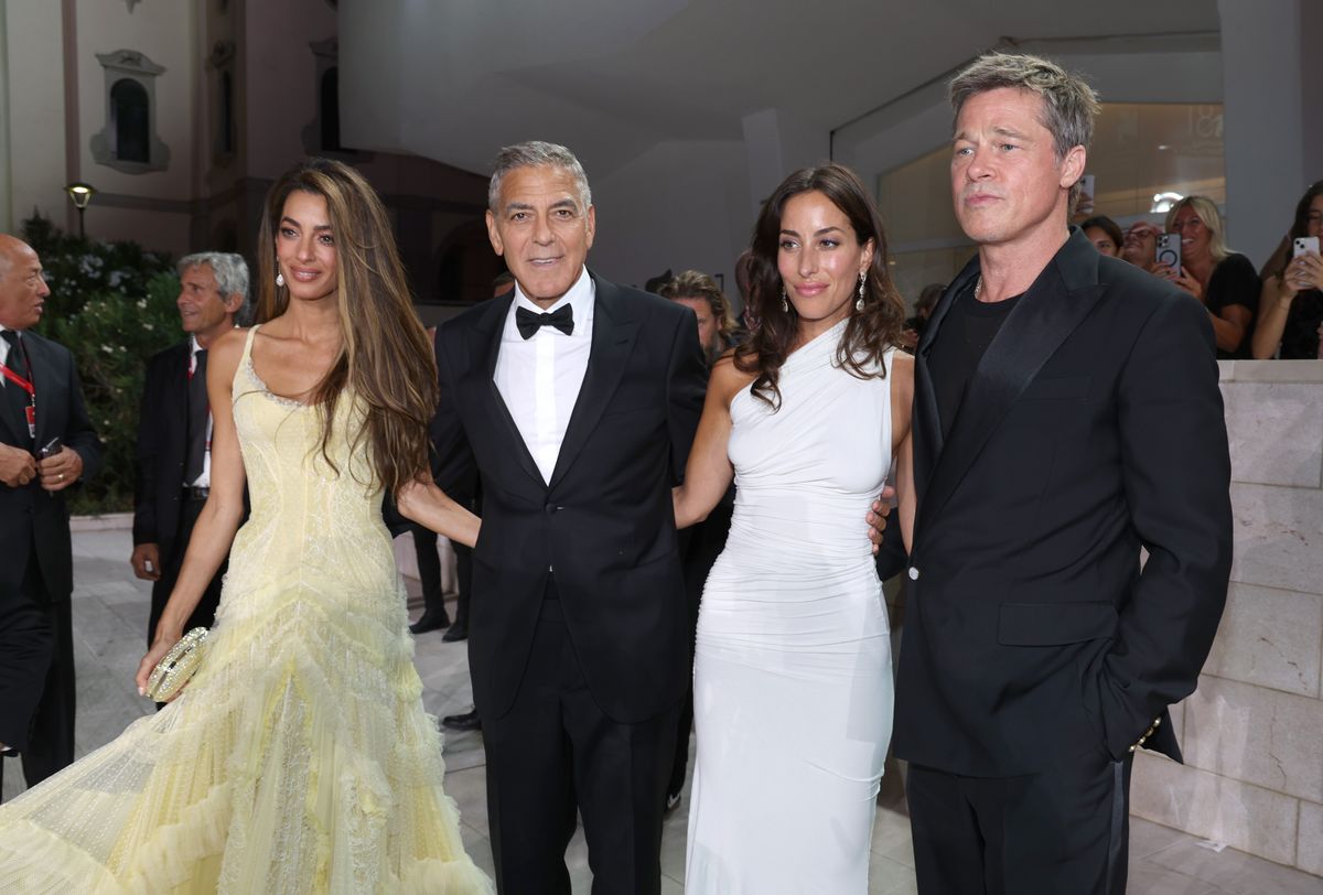 Amal Clooney, George Clooney, Brad Pitt and Ines de Ramon attend the "Wolfs" red carpet during the 81st Venice International Film Festival 