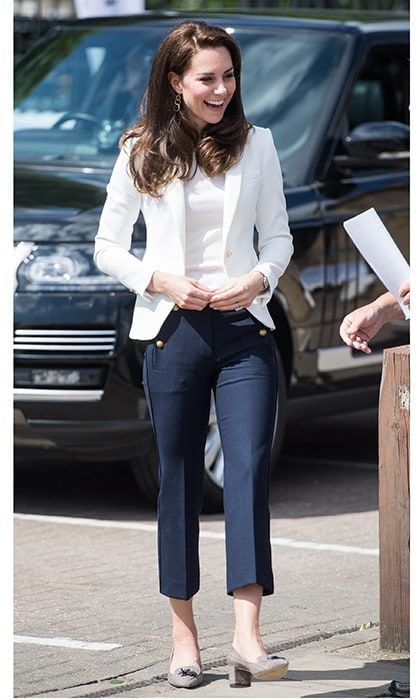 It's not often we see Kate Middleton in tailored pants instead of a skirt! Dressed in a tailored blazer from Zara and cropped navy blue trousers, the Duchess of Cambridge looked fabulous at the 1851 Trust Roadshow in association with Land Rover on London's Isle of Dogs on June 15, 2017. The royal style icon accessorized her nautical-inspired look with a pair of block-heeled J Crew shoes, gold earrings and of course her dazzling sapphire and diamond ring.
Kate has worn the white Zara blazer before - she chose the summer-ready piece for the final day of the royal tour in Canada in 2016.
Photo: Getty Images