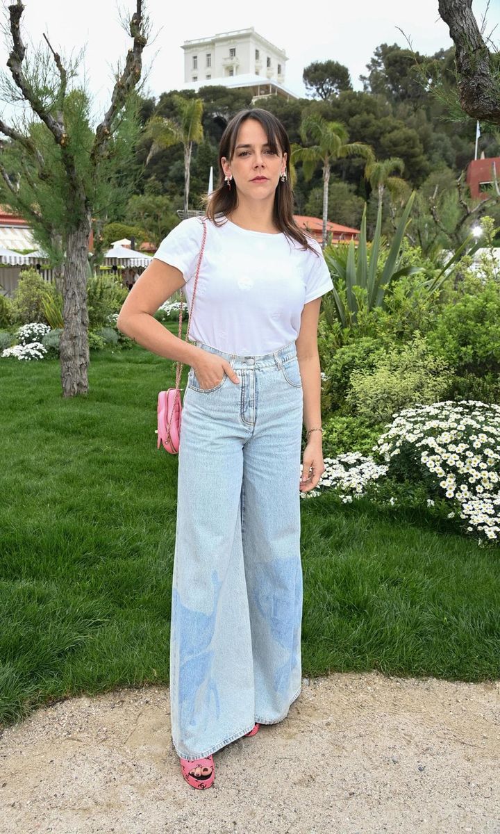 Prince Albert's niece Pauline also stepped out wearing jeans to the show. The designer paired her wide-leg jeans with a white tee and pink purse.